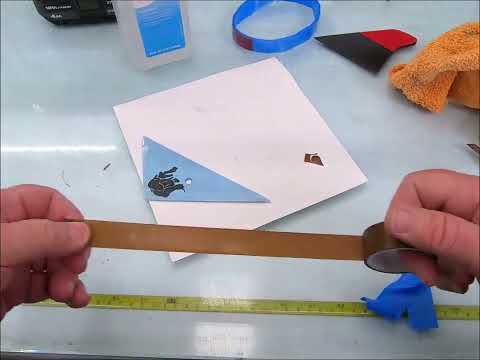 How to install Slip Tape on window tinting tools, demonstrating the proper technique for applying protective tape to prevent scratches during film installation.